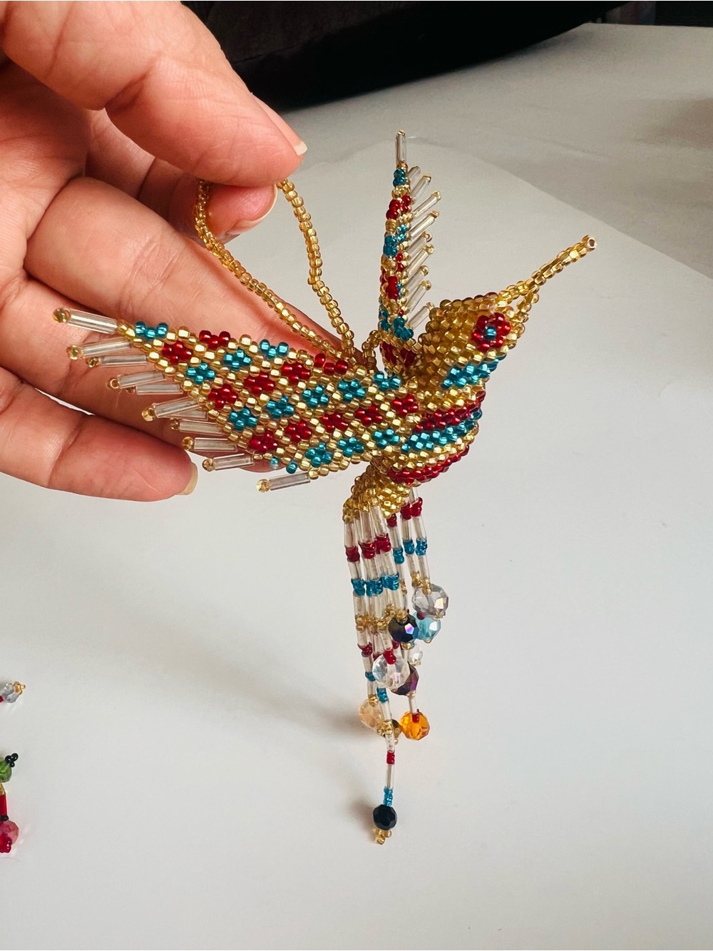 Gold Beaded Hummingbird Pendant with Red and Blue Accents